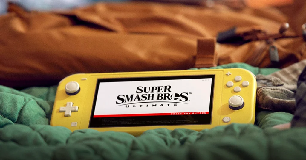 Nintendo Switch Lite amarilla encendida sobre una manta
